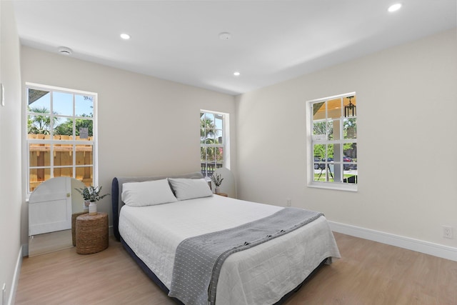 108 NW 4th Ave, Delray Beach, FL 33444 - bedroom featuring light wood-style flooring, recessed lighting, and baseboards