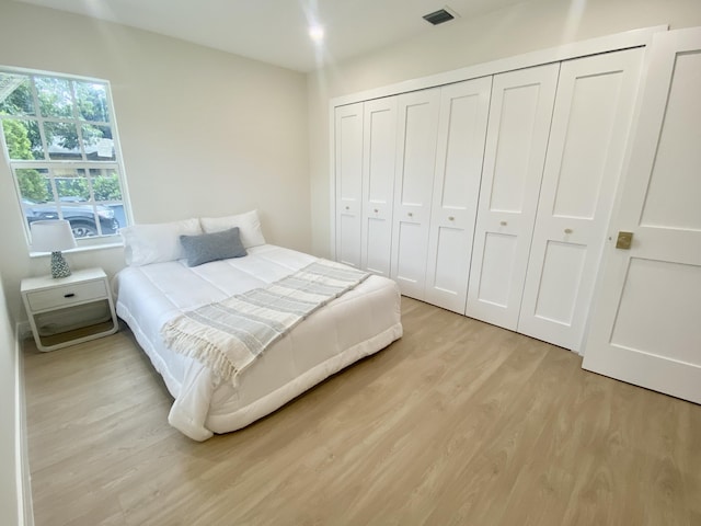108 NW 4th Ave, Delray Beach, FL 33444 - bedroom featuring light wood-style flooring and a closet