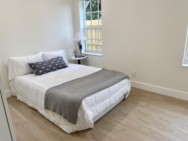 108 NW 4th Ave, Delray Beach, FL 33444 - bedroom featuring wood finished floors and baseboards