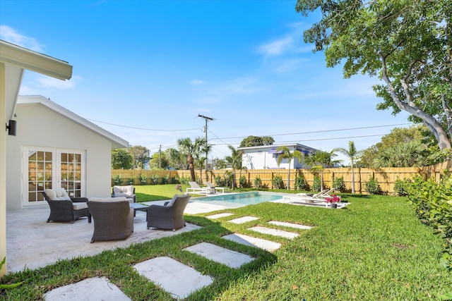 view of yard with french doors, a patio area, and an outdoor hangout area