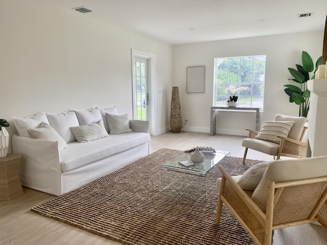 108 NW 4th Ave, Delray Beach, FL 33444 - living room featuring light wood finished floors and baseboards
