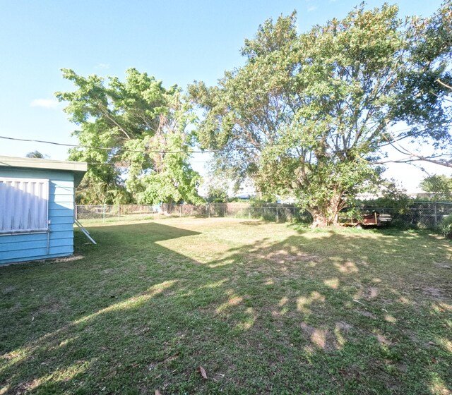 view of yard with a fenced backyard