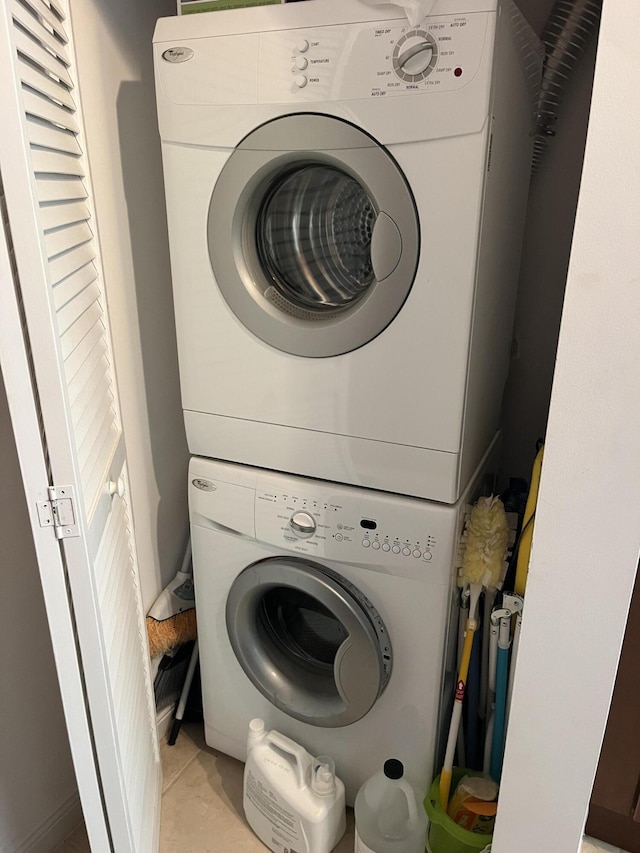 laundry room featuring stacked washing maching and dryer and laundry area