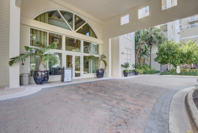 entrance to property with stucco siding and french doors