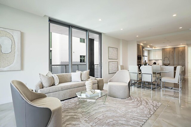 living area with recessed lighting and baseboards