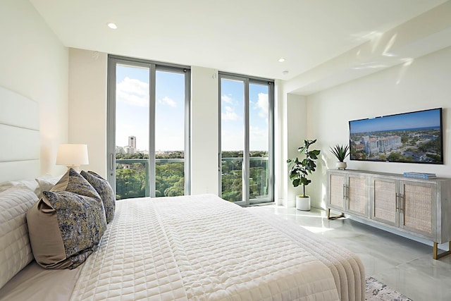 bedroom featuring recessed lighting and expansive windows