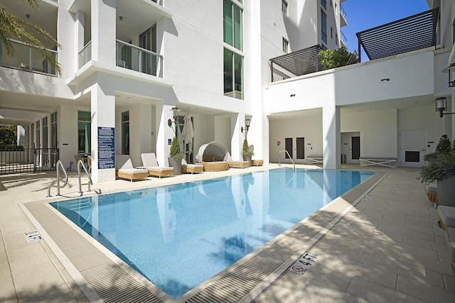 community pool featuring a patio area