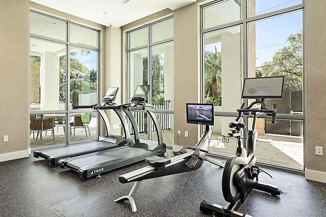 workout area featuring baseboards