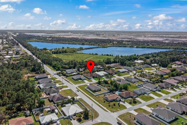 bird's eye view with a residential view and a water view