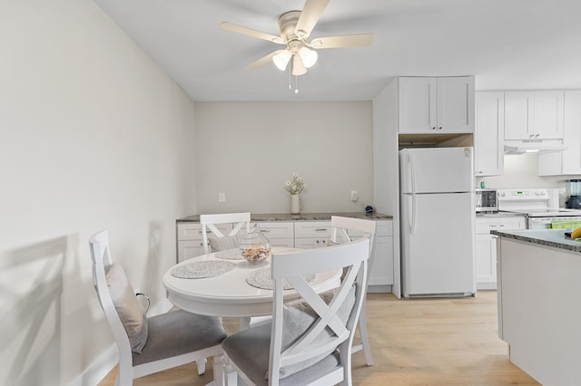 dining room with light wood-style flooring and ceiling fan