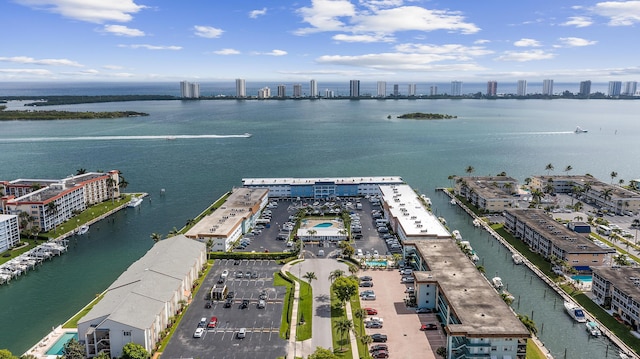 drone / aerial view with a water view and a city view