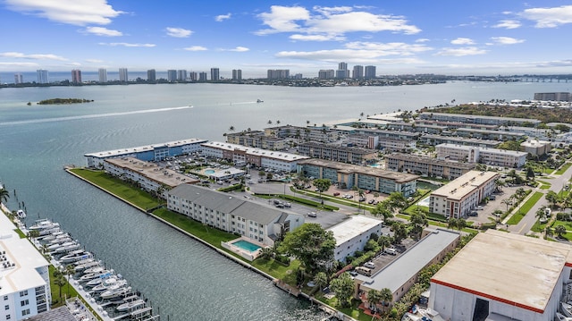 bird's eye view featuring a water view and a view of city