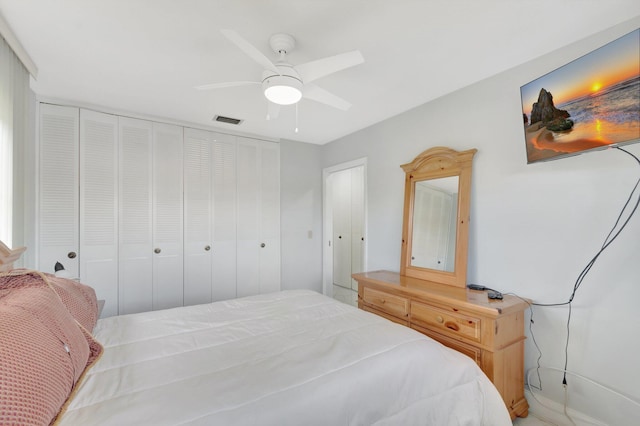 bedroom with a ceiling fan and visible vents