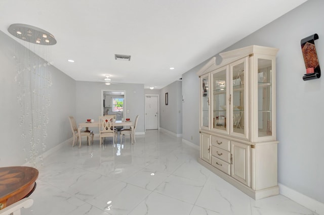 dining space with marble finish floor, visible vents, and baseboards