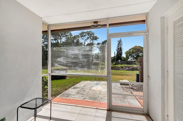 doorway with tile patterned floors