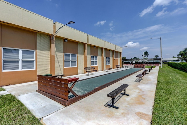 view of swimming pool with a yard