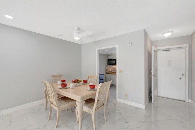 dining area with marble finish floor, ceiling fan, baseboards, and recessed lighting