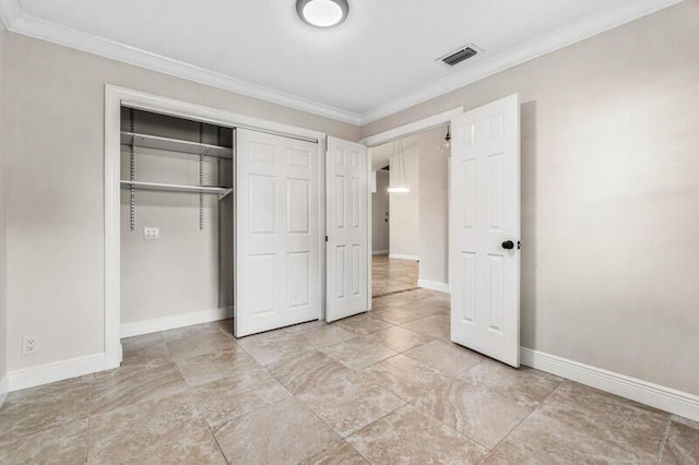 unfurnished bedroom with crown molding, baseboards, a closet, and visible vents