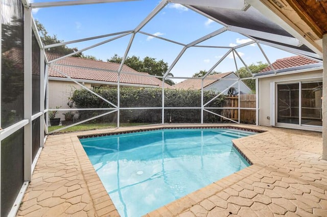 view of pool featuring a fenced in pool, a lanai, and a patio area