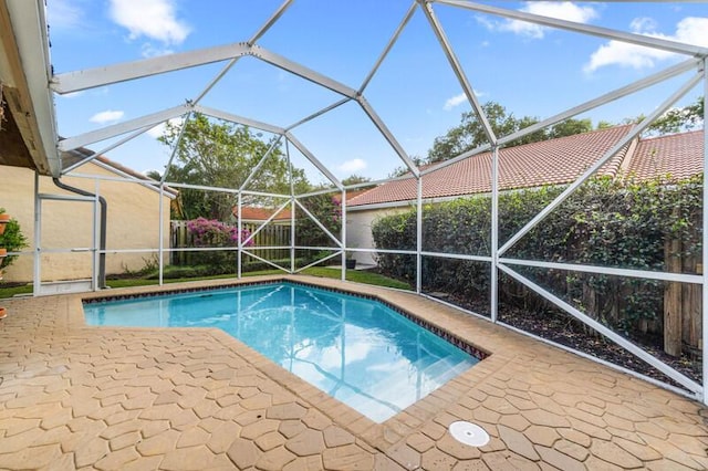 view of pool featuring a fenced in pool, a lanai, and a patio area