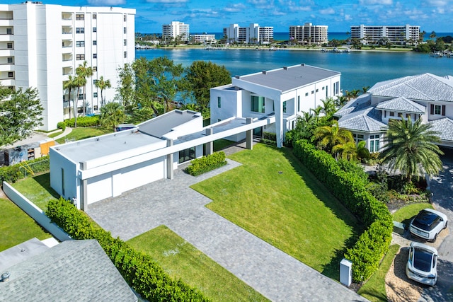 drone / aerial view featuring a water view and a view of city