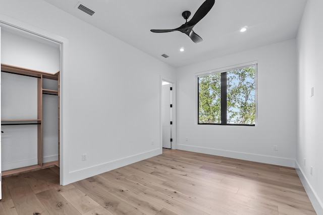 unfurnished bedroom with light wood-style flooring, visible vents, baseboards, and recessed lighting