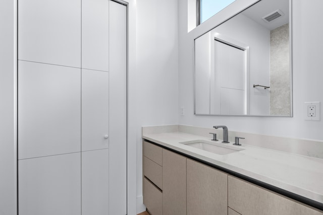 bathroom featuring visible vents and vanity