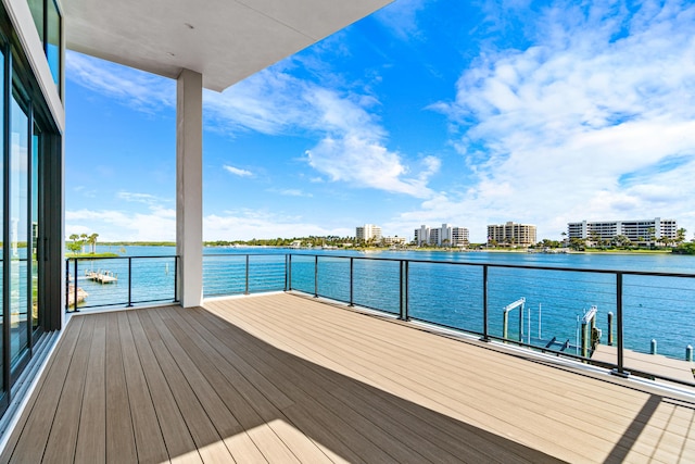 exterior space with a view of city, a water view, and a balcony