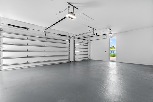 garage featuring baseboards and a garage door opener