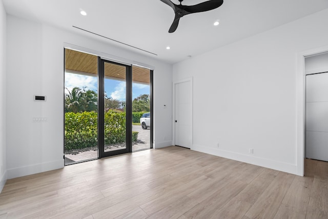 spare room with light wood-type flooring, ceiling fan, baseboards, and recessed lighting