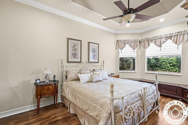 bedroom with baseboards, a ceiling fan, wood finished floors, and crown molding