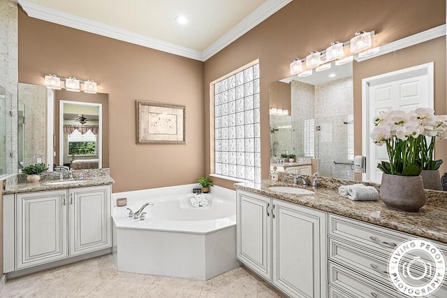 full bathroom featuring a sink, a bath, a shower stall, and crown molding