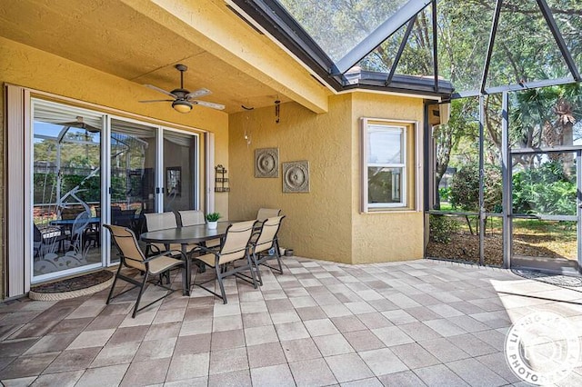 sunroom / solarium with ceiling fan