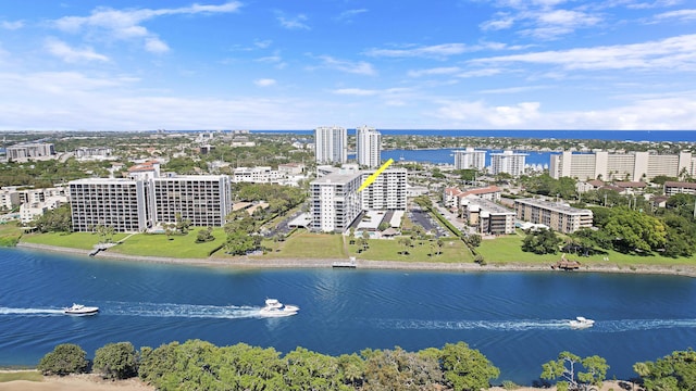 drone / aerial view with a view of city and a water view