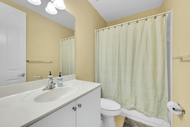 bathroom featuring toilet, shower / bath combo, and vanity