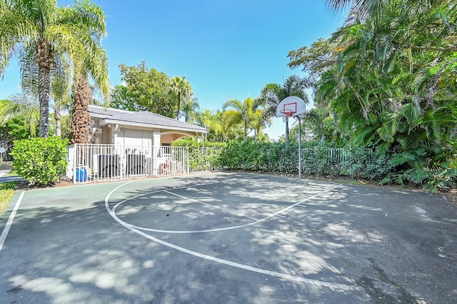 view of basketball court featuring community basketball court and fence