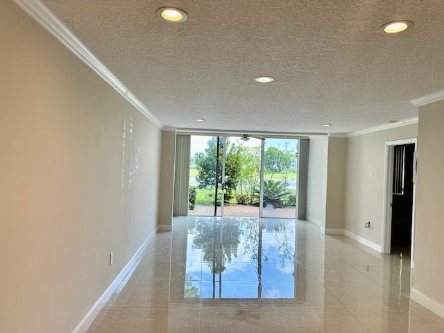 4822 Esedra Ct Unit 101, Lake Worth, FL 33467 - empty room with baseboards, ornamental molding, a textured ceiling, floor to ceiling windows, and recessed lighting