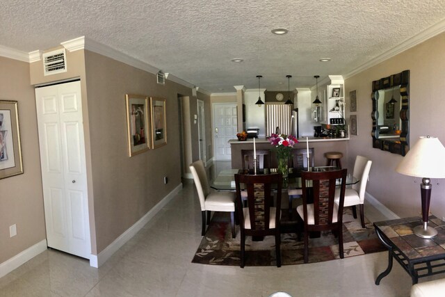 dining room with baseboards, recessed lighting, tile patterned floors, and crown molding