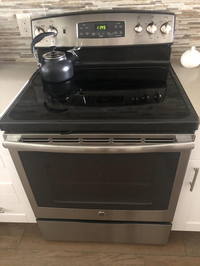4822 Esedra Ct Unit 101, Lake Worth, FL 33467 - kitchen view of stainless steel electric range and white cabinetry