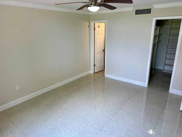 4822 Esedra Ct Unit 101, Lake Worth, FL 33467 - unfurnished bedroom with a walk in closet, ornamental molding, baseboards, a closet, and ceiling fan