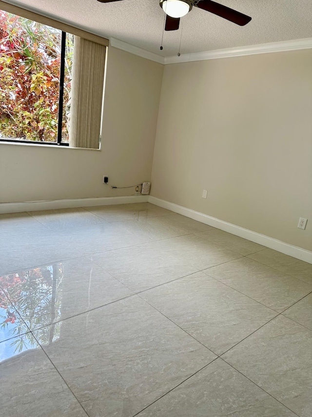 4822 Esedra Ct Unit 101, Lake Worth, FL 33467 - unfurnished room featuring a ceiling fan, ornamental molding, a textured ceiling, and baseboards