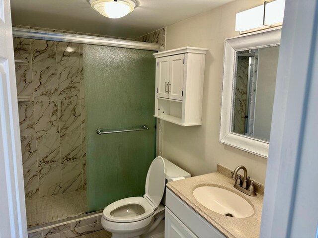 4822 Esedra Ct Unit 101, Lake Worth, FL 33467 - bathroom featuring toilet, a stall shower, and vanity
