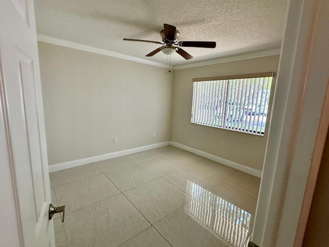 4822 Esedra Ct Unit 101, Lake Worth, FL 33467 - tiled spare room with a ceiling fan, a textured ceiling, crown molding, and baseboards