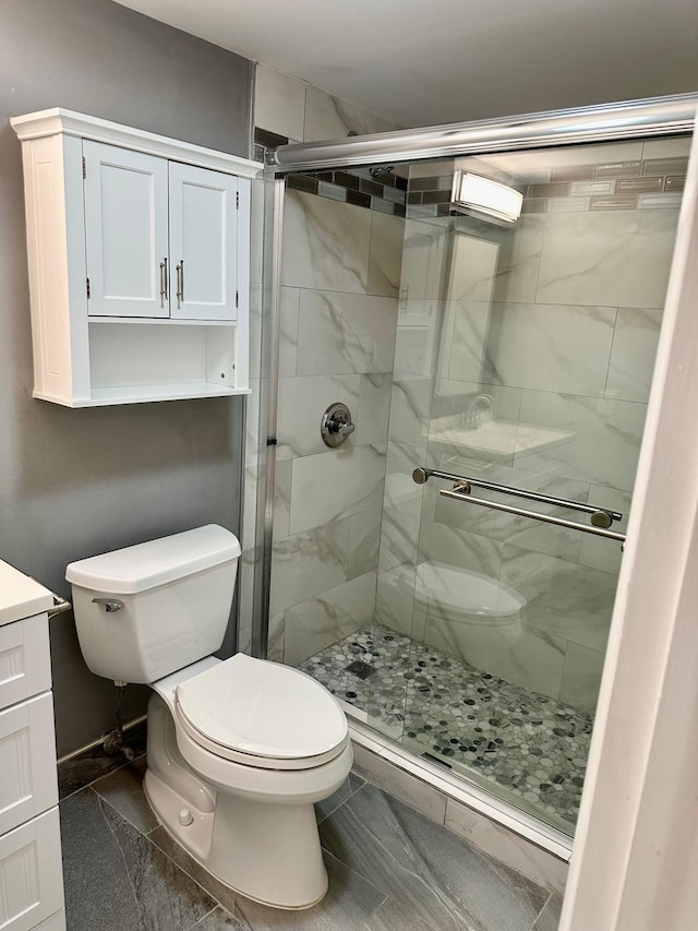 4822 Esedra Ct Unit 101, Lake Worth, FL 33467 - full bathroom featuring toilet, a shower stall, vanity, and baseboards