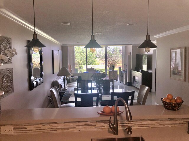 living room with a textured ceiling and crown molding