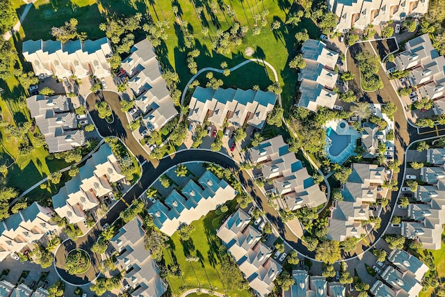 birds eye view of property with a residential view