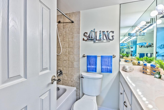 bathroom featuring toilet, shower / bathtub combination, and vanity