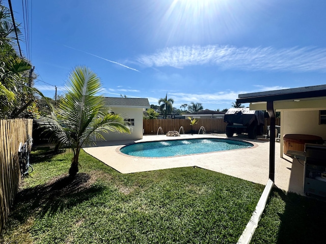 view of swimming pool with a patio area, a fenced backyard, a fenced in pool, and a yard