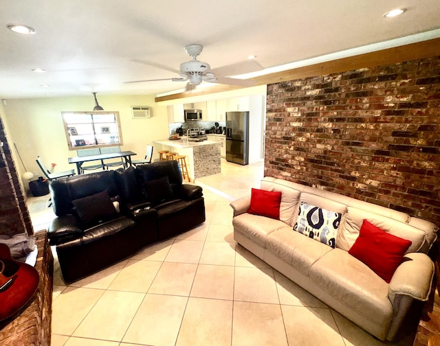 living area featuring a wall unit AC, light tile patterned floors, recessed lighting, ceiling fan, and brick wall