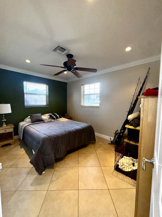 bedroom featuring light tile patterned floors, ornamental molding, multiple windows, and visible vents